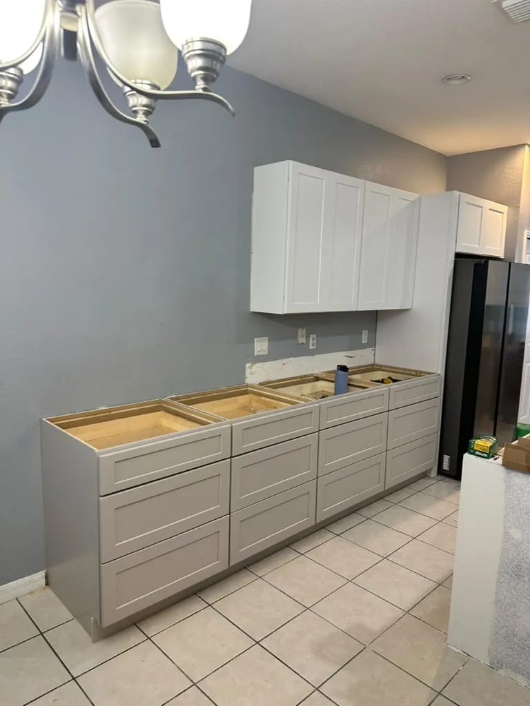 New shaker cabinets being installed before the countertop goes on