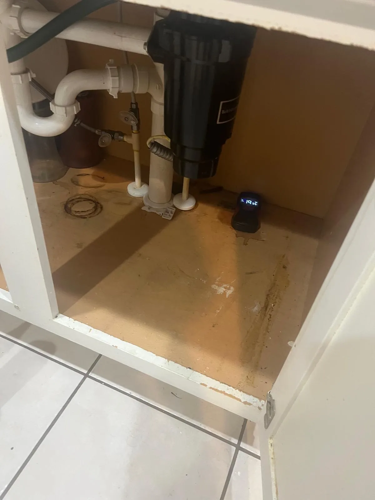 Moisture meter reading inside the cabinet under the sink
